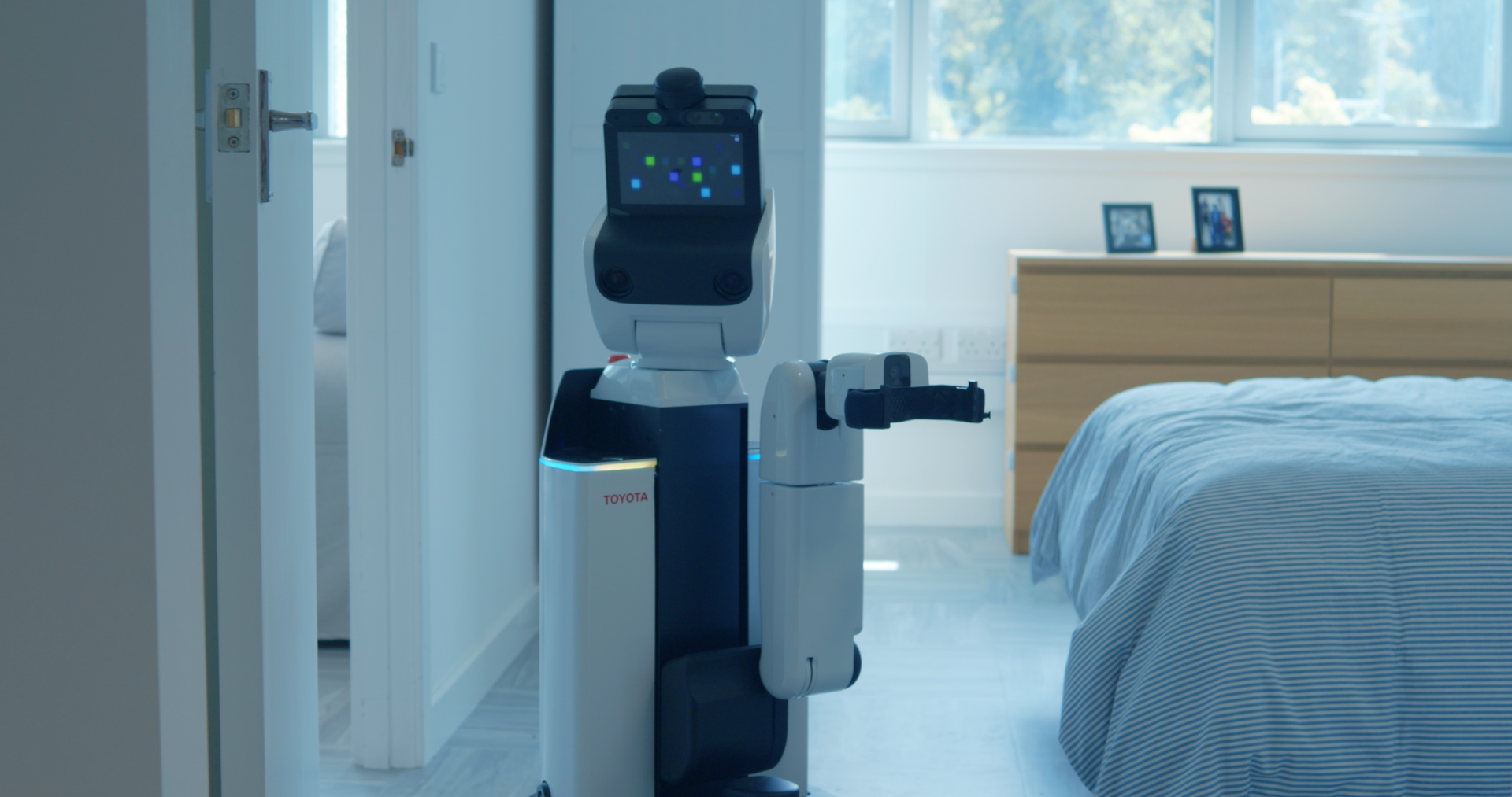 Domestic robot within bedroom setting