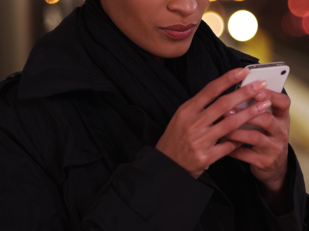stock image of woman looking at mobile phone