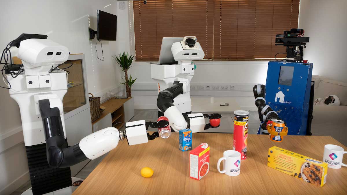 Humanoid robots around breakfast table